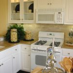 traditional white kitchen cabinets with white appliances XGEBMZP