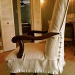 Chair Slipcover with exposed arms. Pleats on bottom, and buttons .
