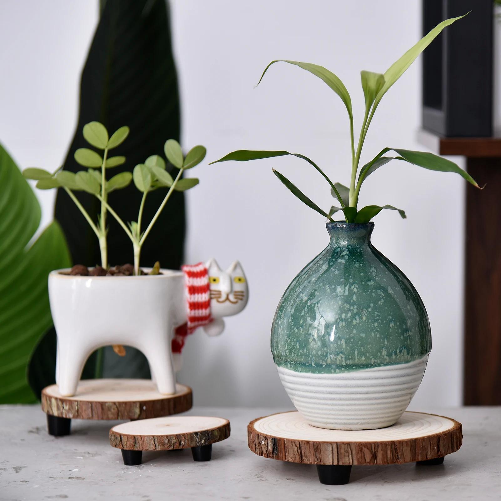 Wooden plant holders introduce ​greenery into your wooden bathroom ⁢space