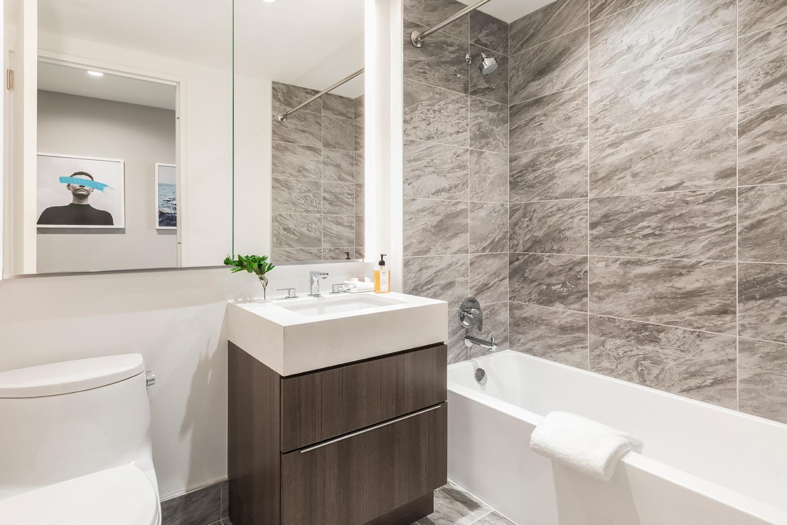 Urban bathroom: Sleek tiles and contemporary fixtures suit city living