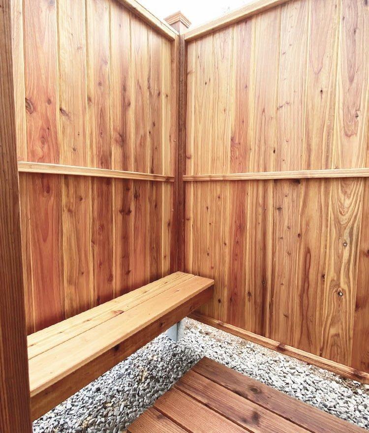 Incorporate wooden accents in your shower enclosure for visual interest