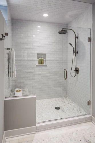 Use glass partitions⁢ to enhance visual space in your⁢ bathroom