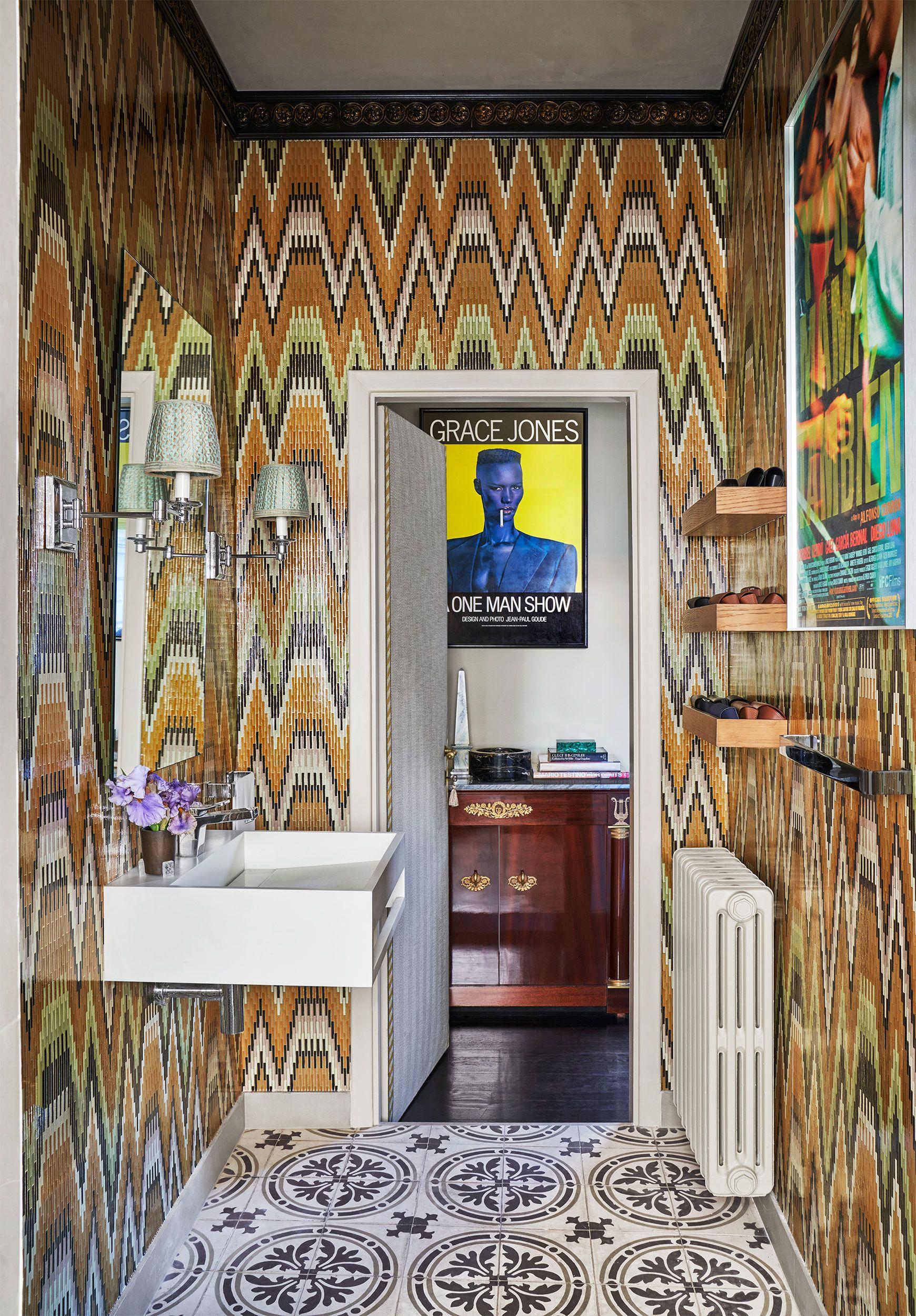 Add a freestanding tub adorned with quirky artwork to elevate your eclectic bathroom