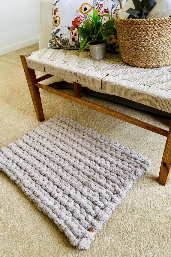 Woven wooden mats add texture to a sleek⁣ wooden bathroom