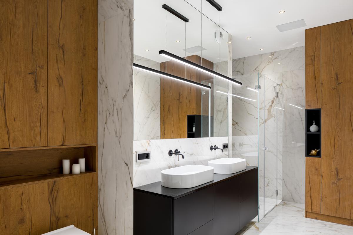 Statement lighting fixtures offer a pop of style in your modern bathroom