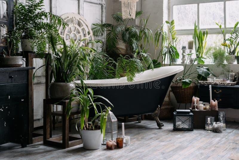 Add a wooden bathtub surrounded by ⁣greenery ‍for a serene feel