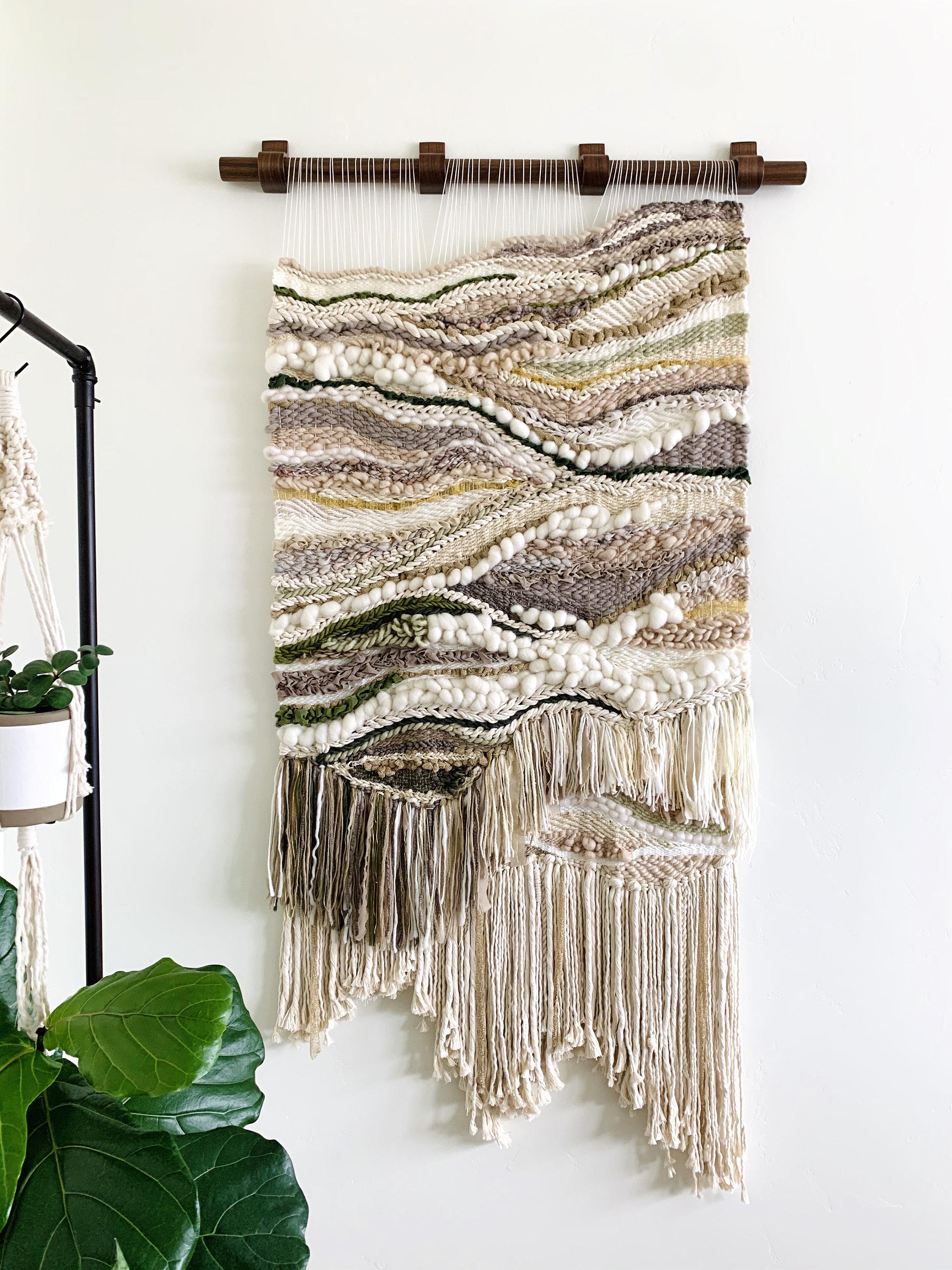 Handwoven macramé wall hangings add texture to your boho bathroom decor