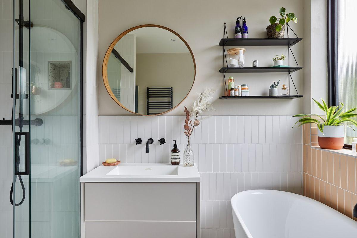 Install an oversized mirror to create an illusion of space in your eclectic bathroom