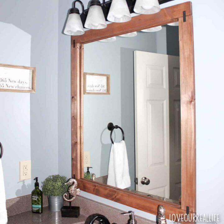 Hang wooden framed ‍mirrors to enhance your ‍wooden bathroom’s design