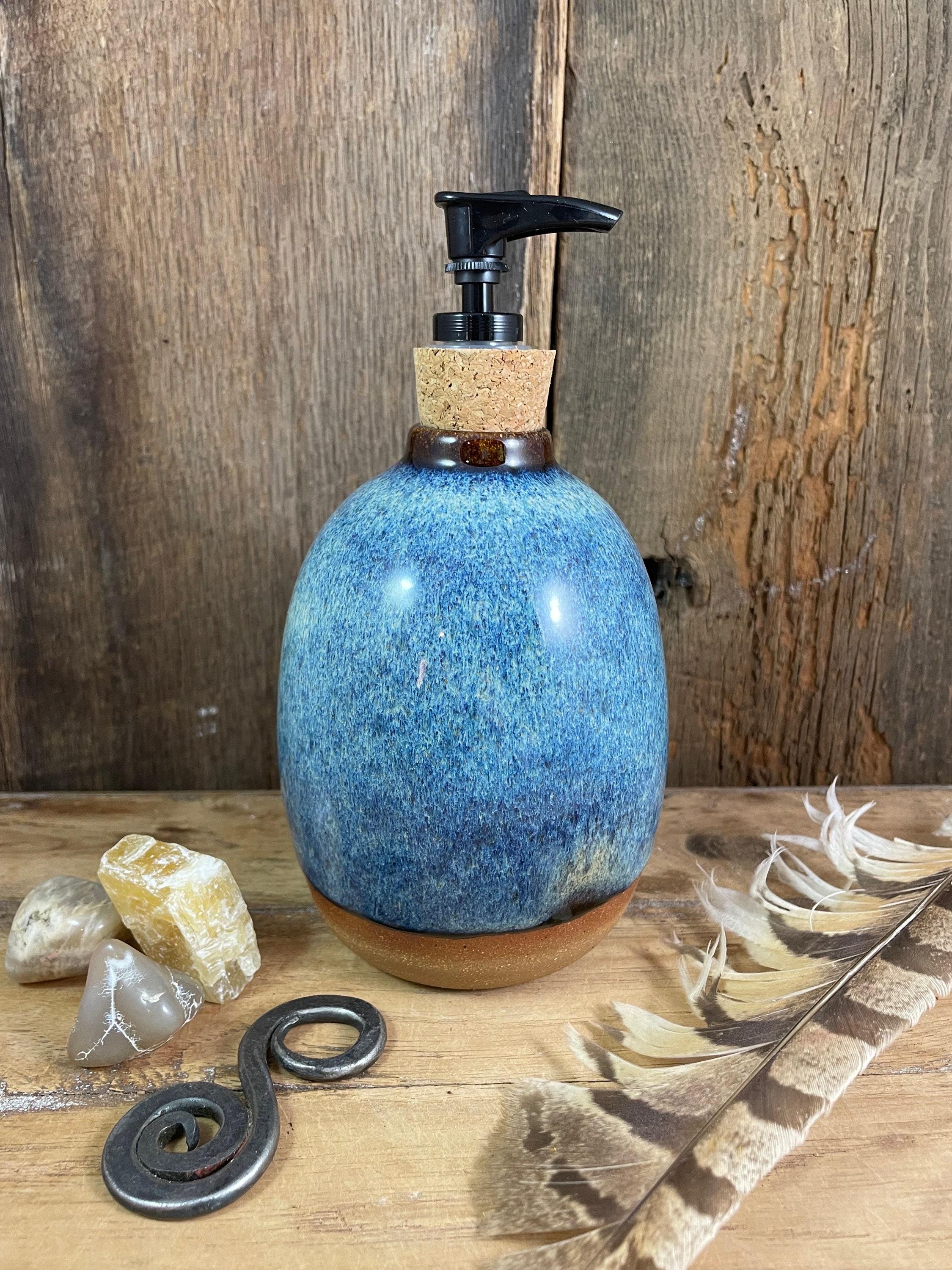 Handmade pottery, like soap dispensers, bring⁣ unique charm to your boho bathroom