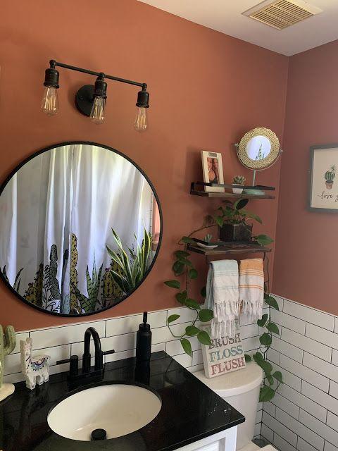 Succulents‌ planted in terracotta pots enhance the natural beauty of your boho bathroom