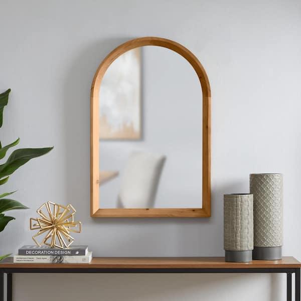 Hang wooden mirrors to reflect warmth and space