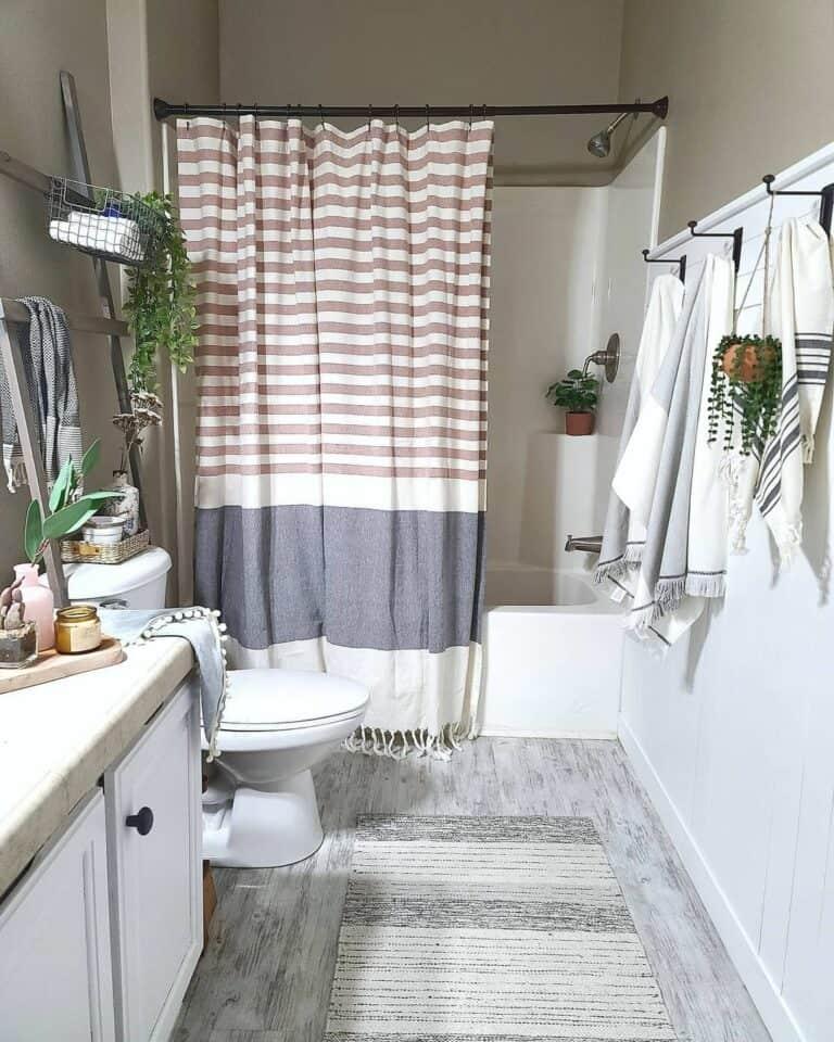 Mix and match shower curtains for a fun and ‍playful eclectic bathroom vibe