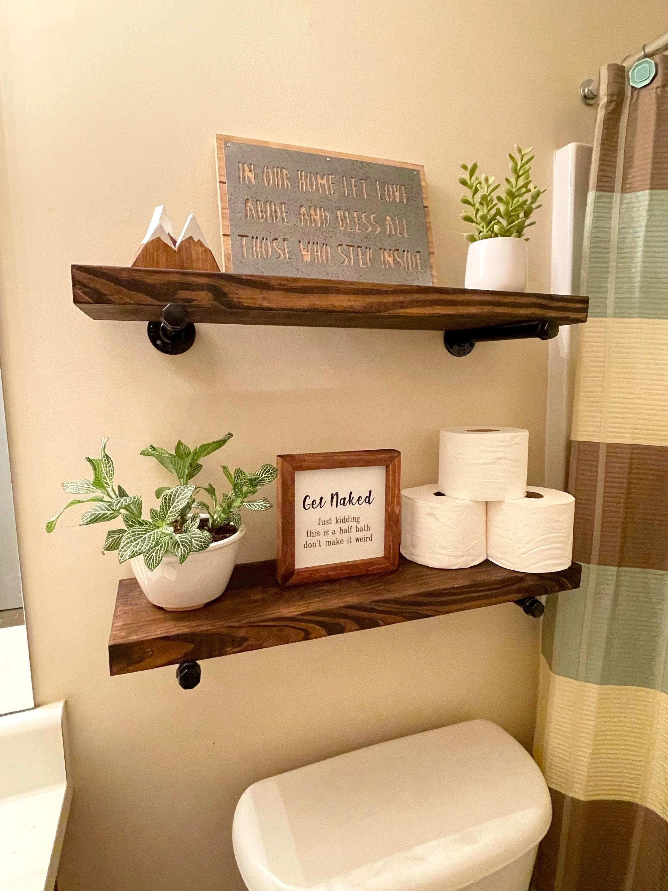 Install wooden shelves for practical storage and display in your wooden bathroom