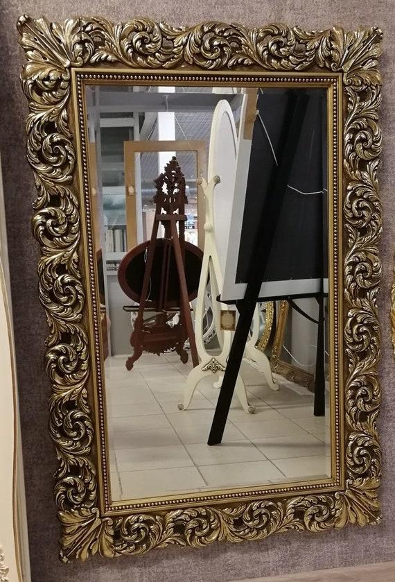 Add‍ a wood-framed mirror for a charming‍ focal point