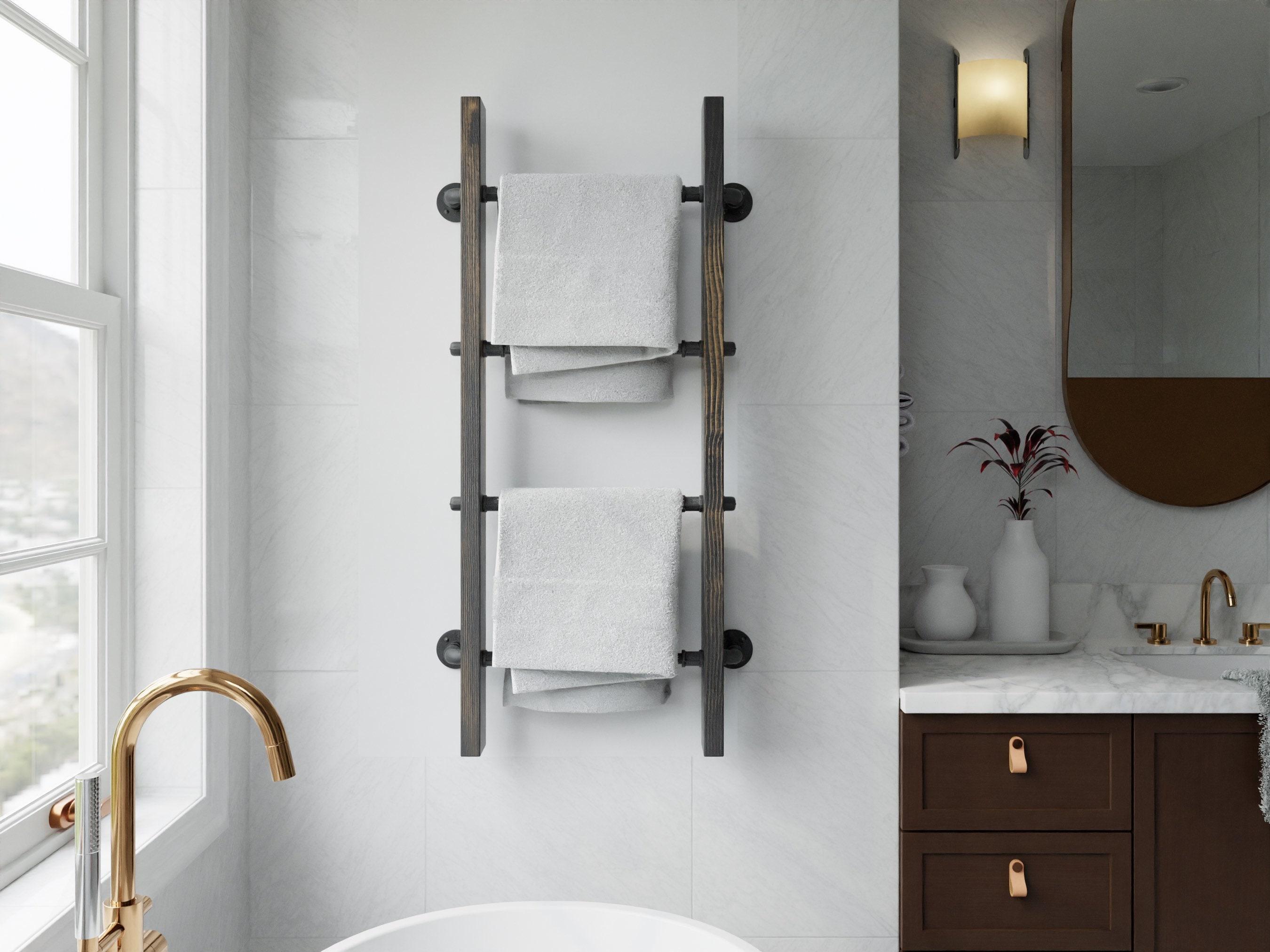 Chic ​wooden ladders serve as⁤ fashionable towel racks in your ‍bathroom