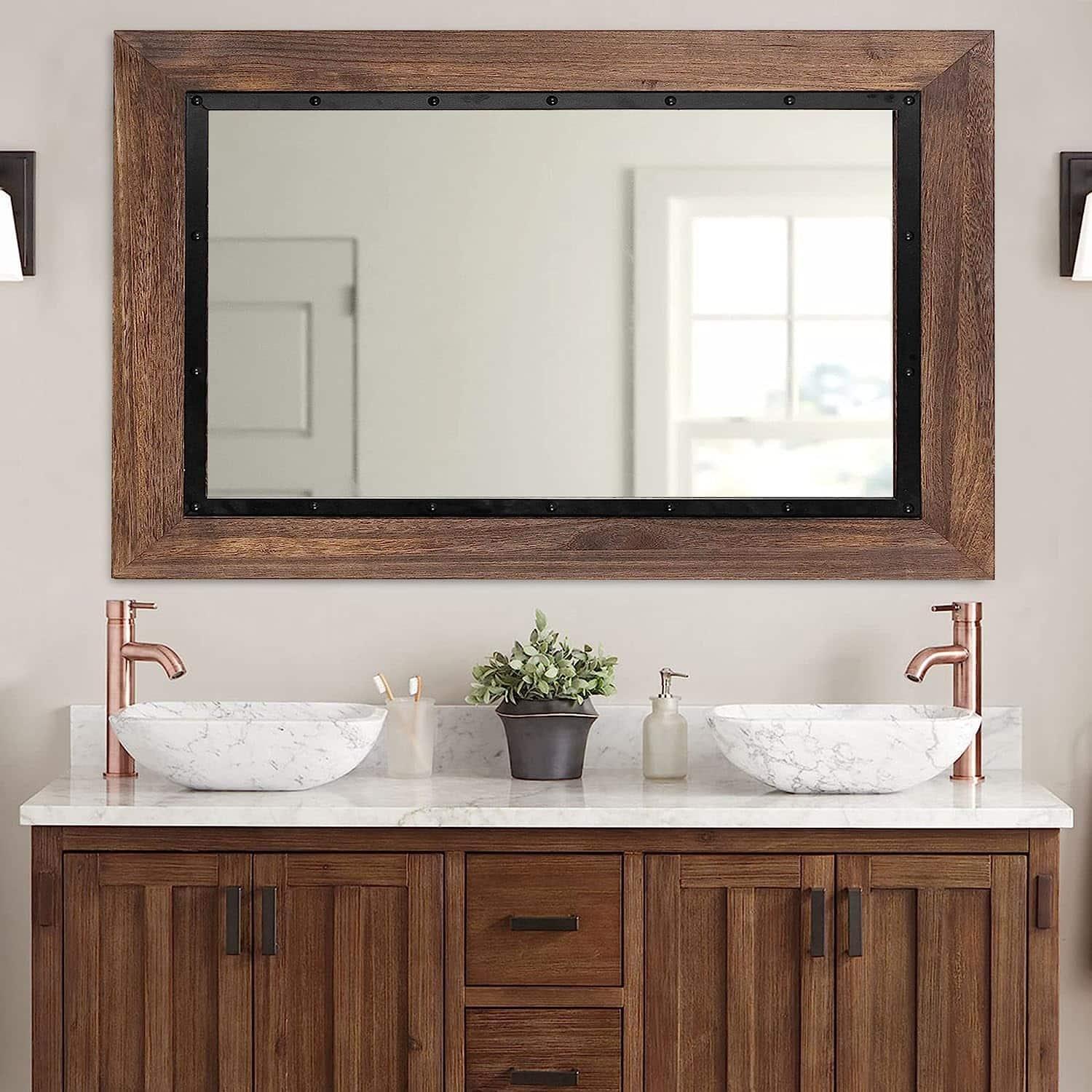 Consider wood-framed ​mirrors for a cohesive wooden bathroom style