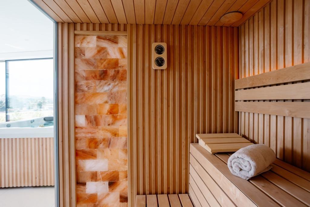 Consider a wooden sauna for a luxurious wooden bathroom retreat