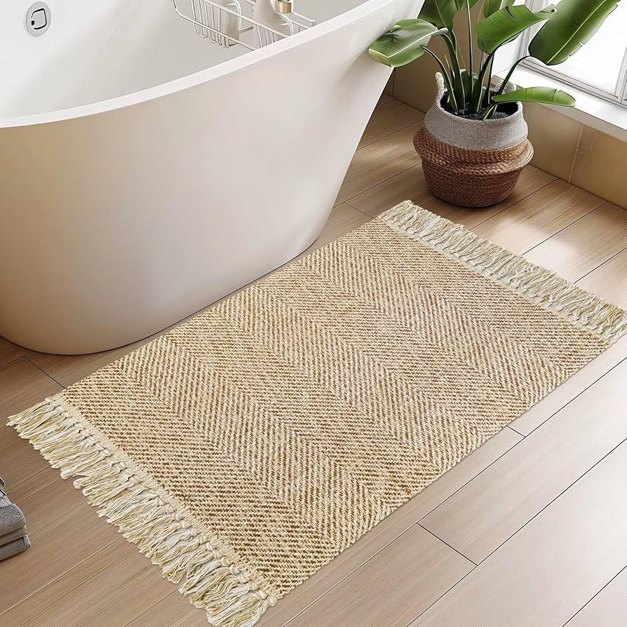 Soft, ‍natural fiber rugs create warmth and comfort in a boho bathroom setting