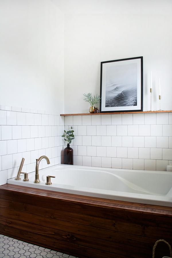 A wooden bathtub serves as a stunning centerpiece in your wooden bathroom