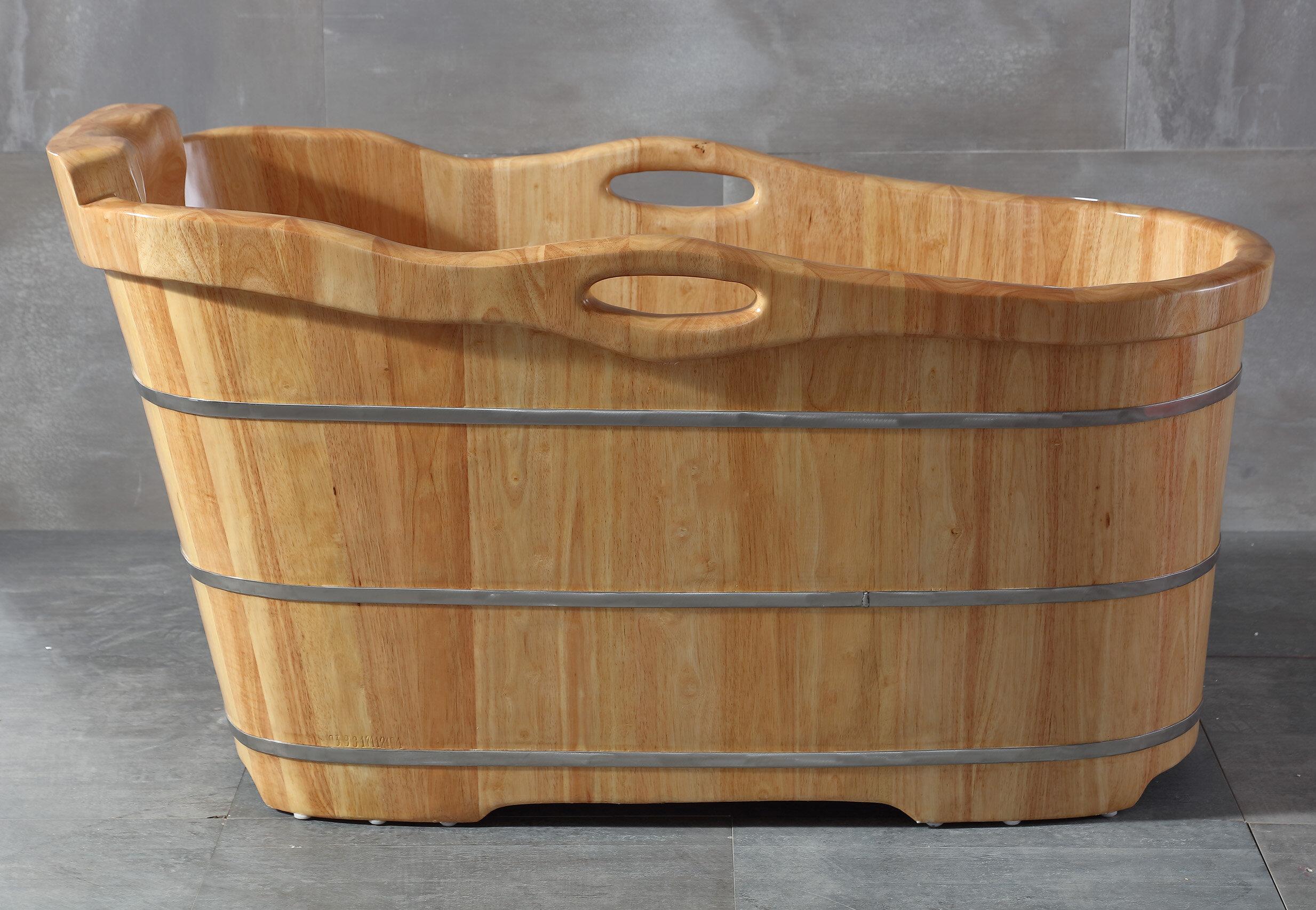 A freestanding wooden bathtub becomes the focal point of your bathroom