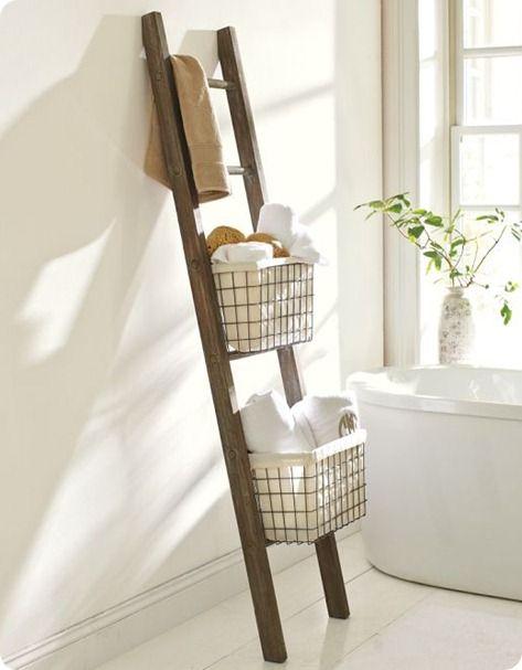 Incorporate a vintage ladder for towel storage in a stylish eclectic bathroom​ twist