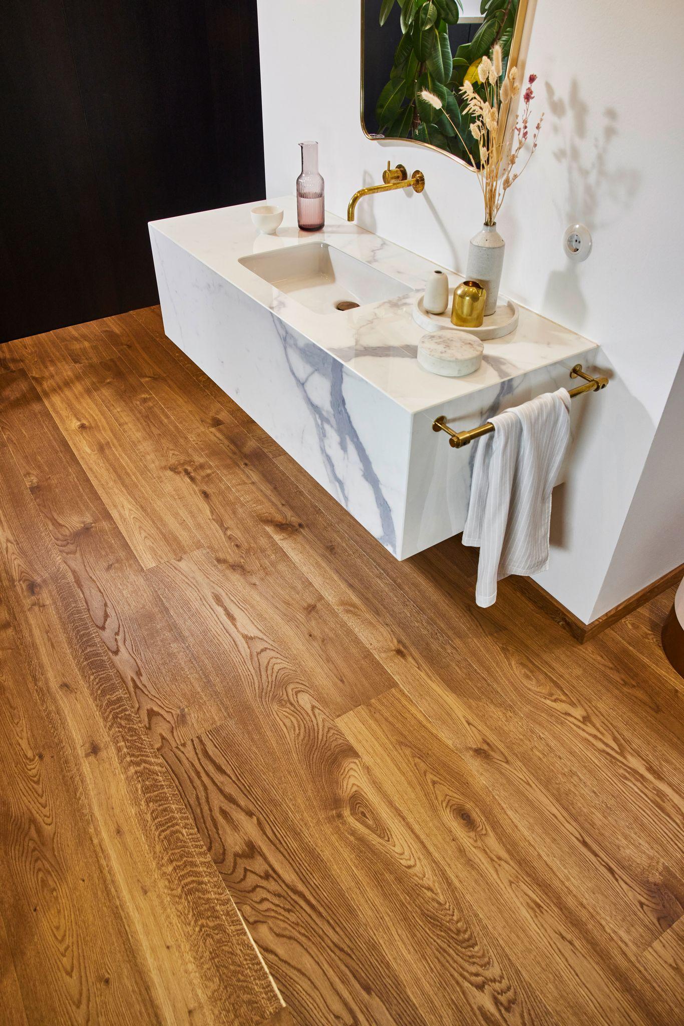 Choose wooden flooring for a cozy feel in your wooden bathroom