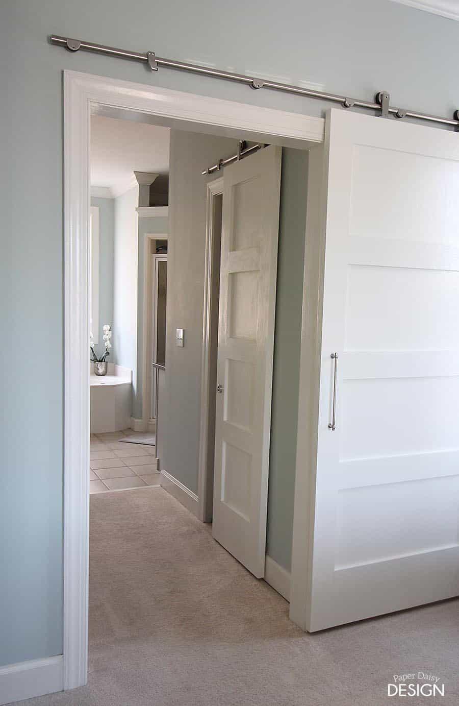 Barn doors add a chic touch to your wooden bathroom entry