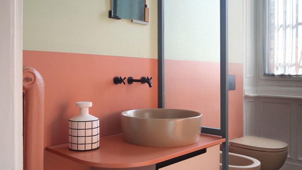 Add open shelving to display quirky decor in your eclectic bathroom