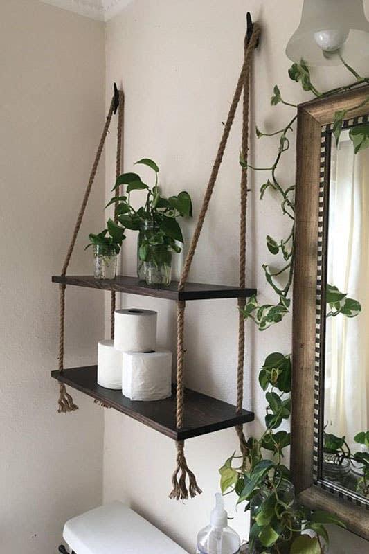 Utilize creative shelving to showcase decor in your eclectic bathroom oasis