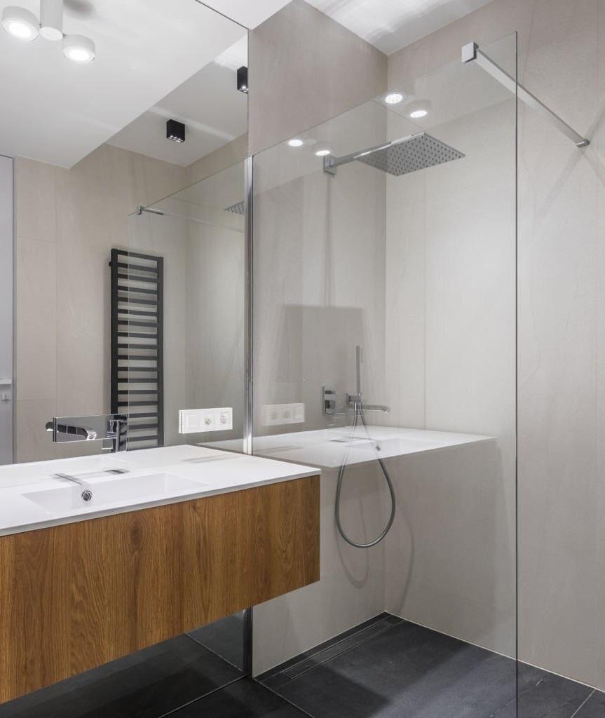 Integrate a walk-in shower with glass walls in modern bathroom