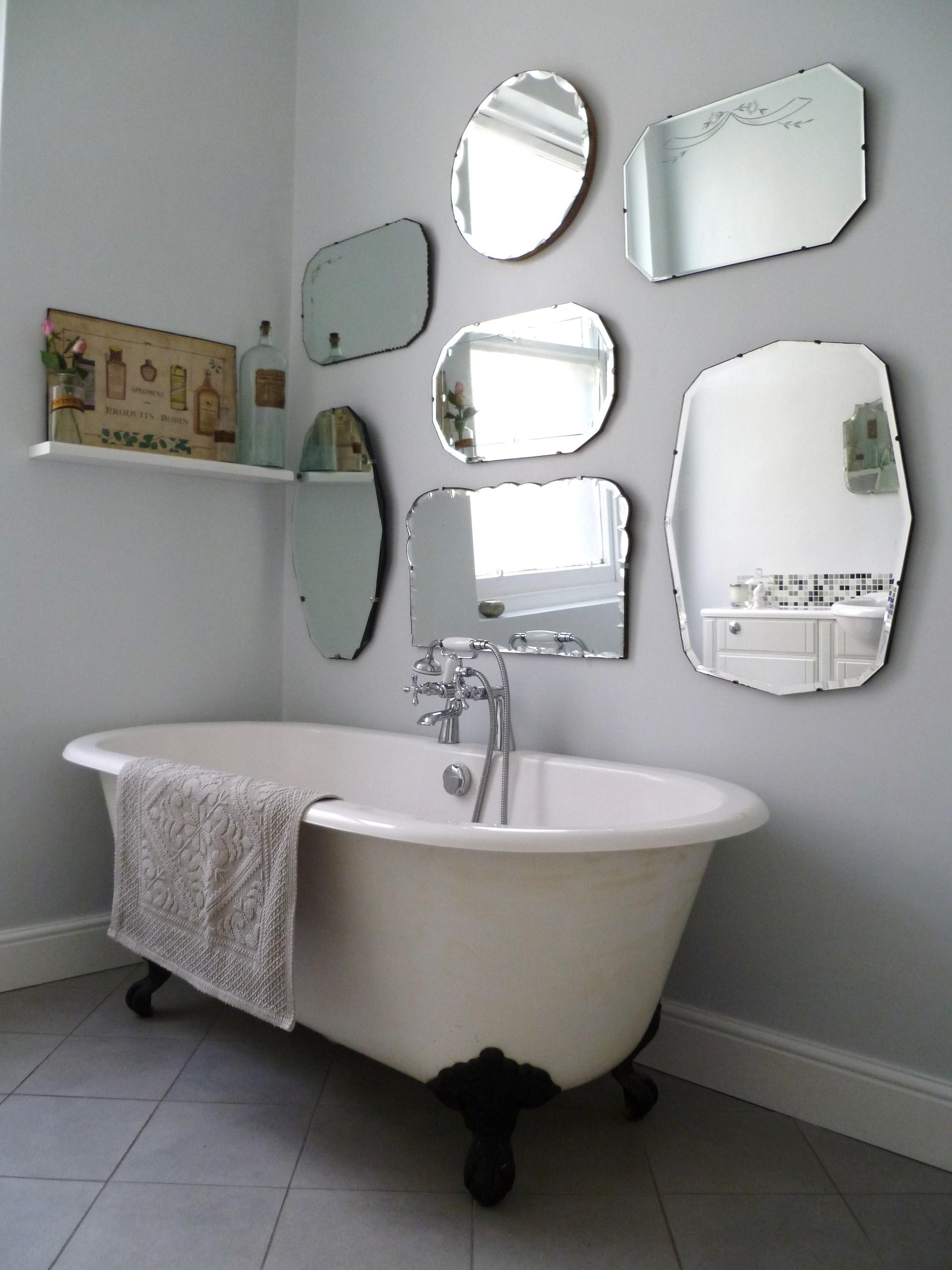 Vintage mirrors add charm and reflect personality in your eclectic‌ bathroom oasis