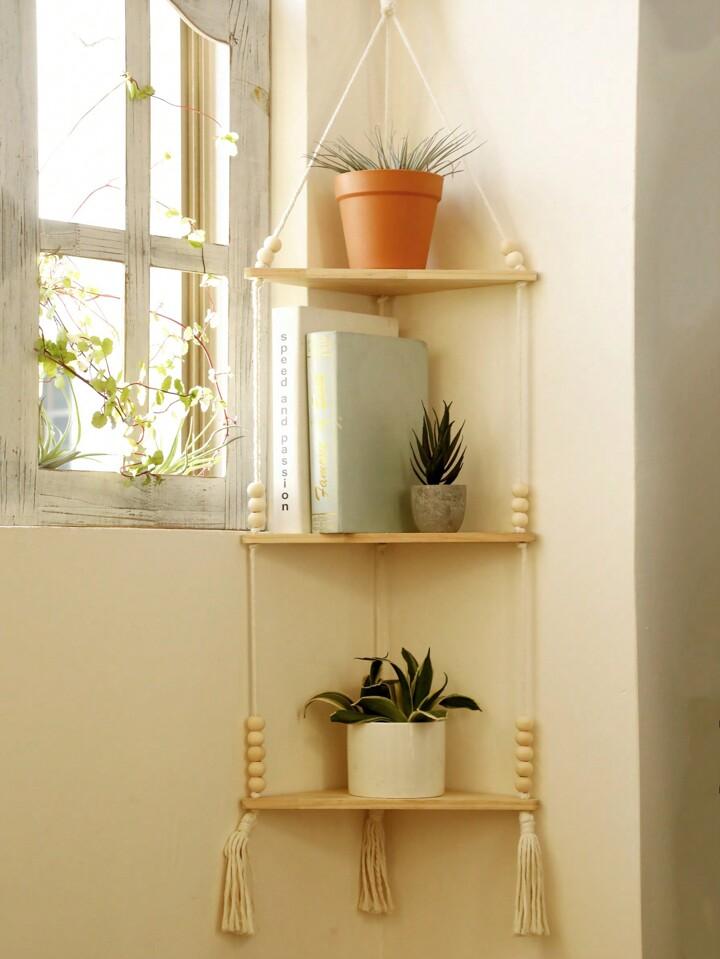 A hanging plant⁣ shelf introduces greenery ​and style into your boho bathroom