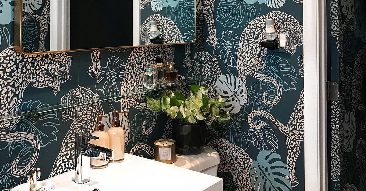 Embrace bold wallpaper patterns to add character to your eclectic bathroom space