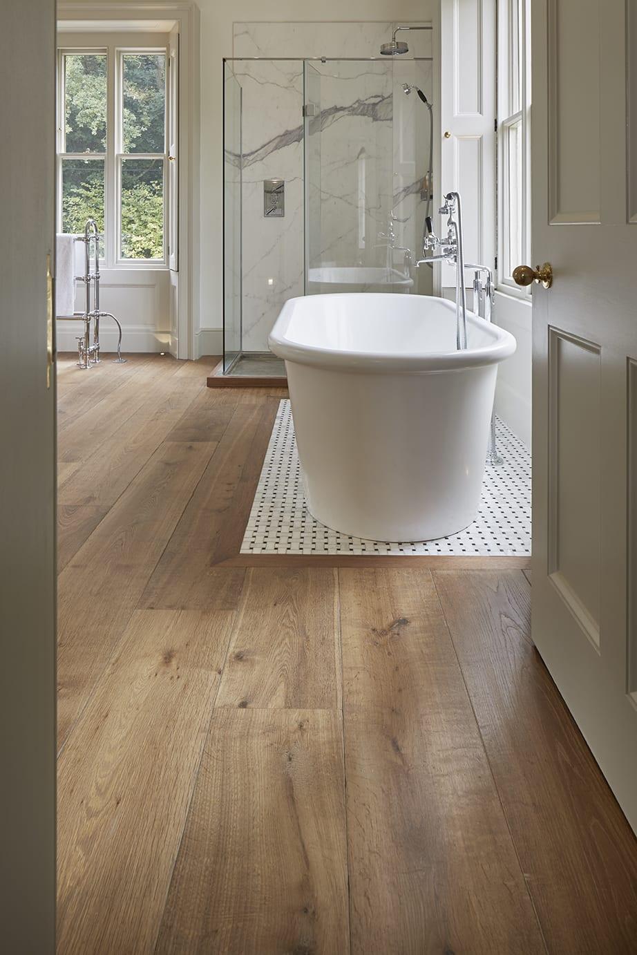 Install wooden bathroom flooring for a cozy feel