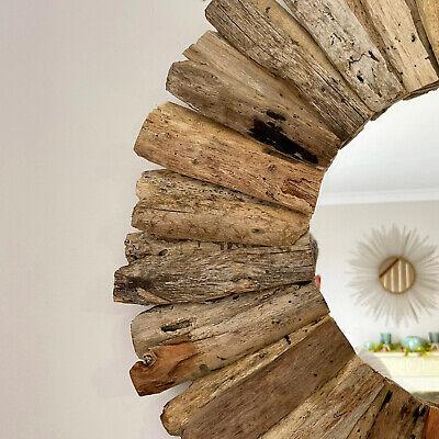 Driftwood mirrors to reflect light and enhance the boho bathroom ambiance