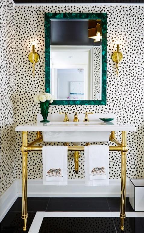 Boldly patterned wallpapers complete the eclectic bathrooms captivating visual story