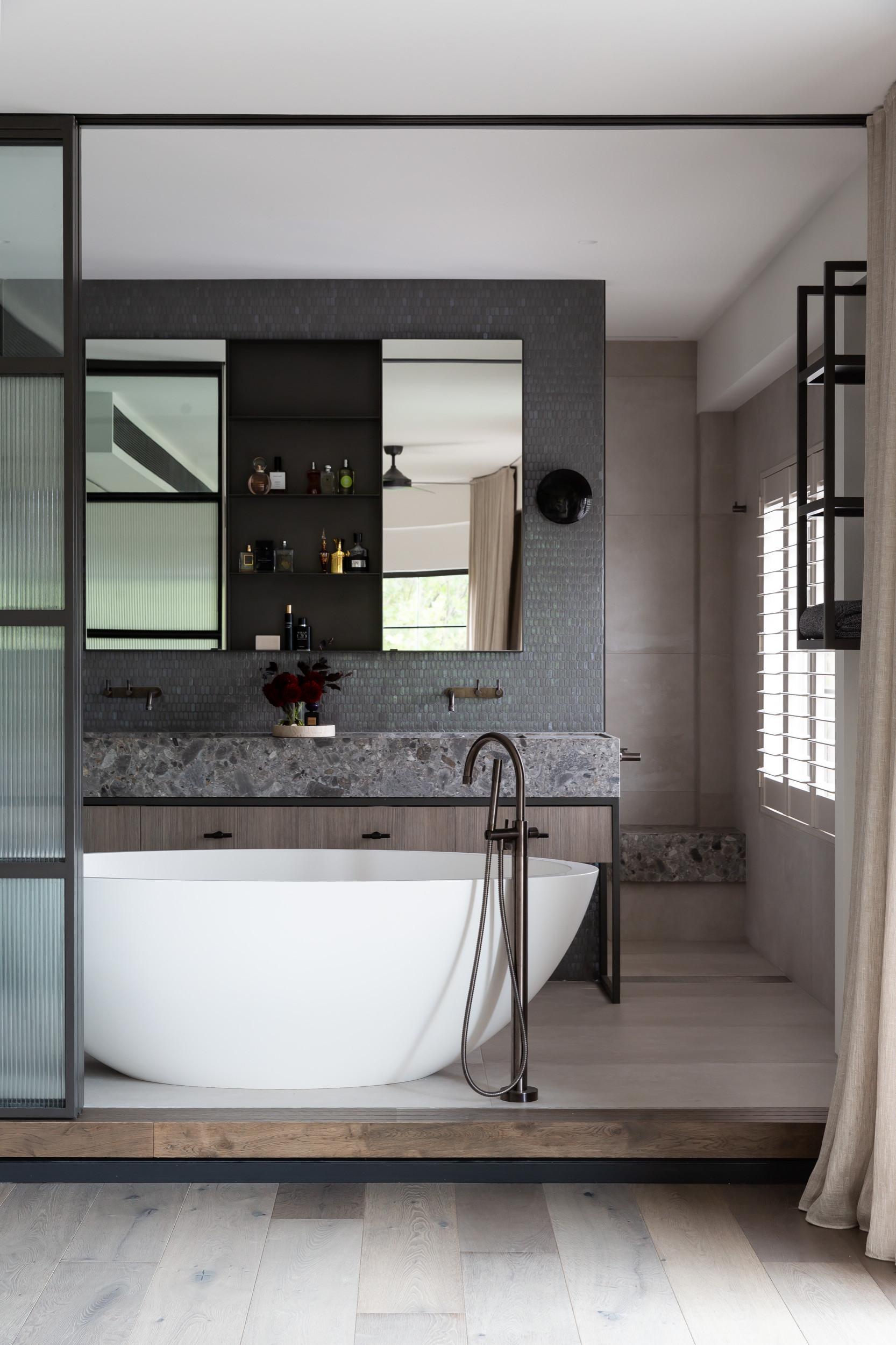 Industrial chic bathroom with exposed brick⁢ and metal​ elements