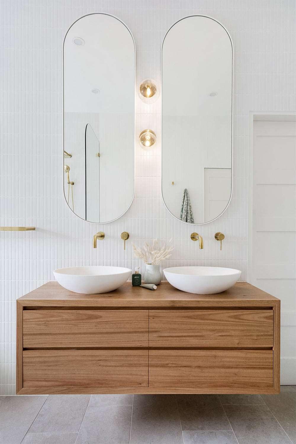 Wooden light fixtures complement the serene vibe of your wooden bathroom