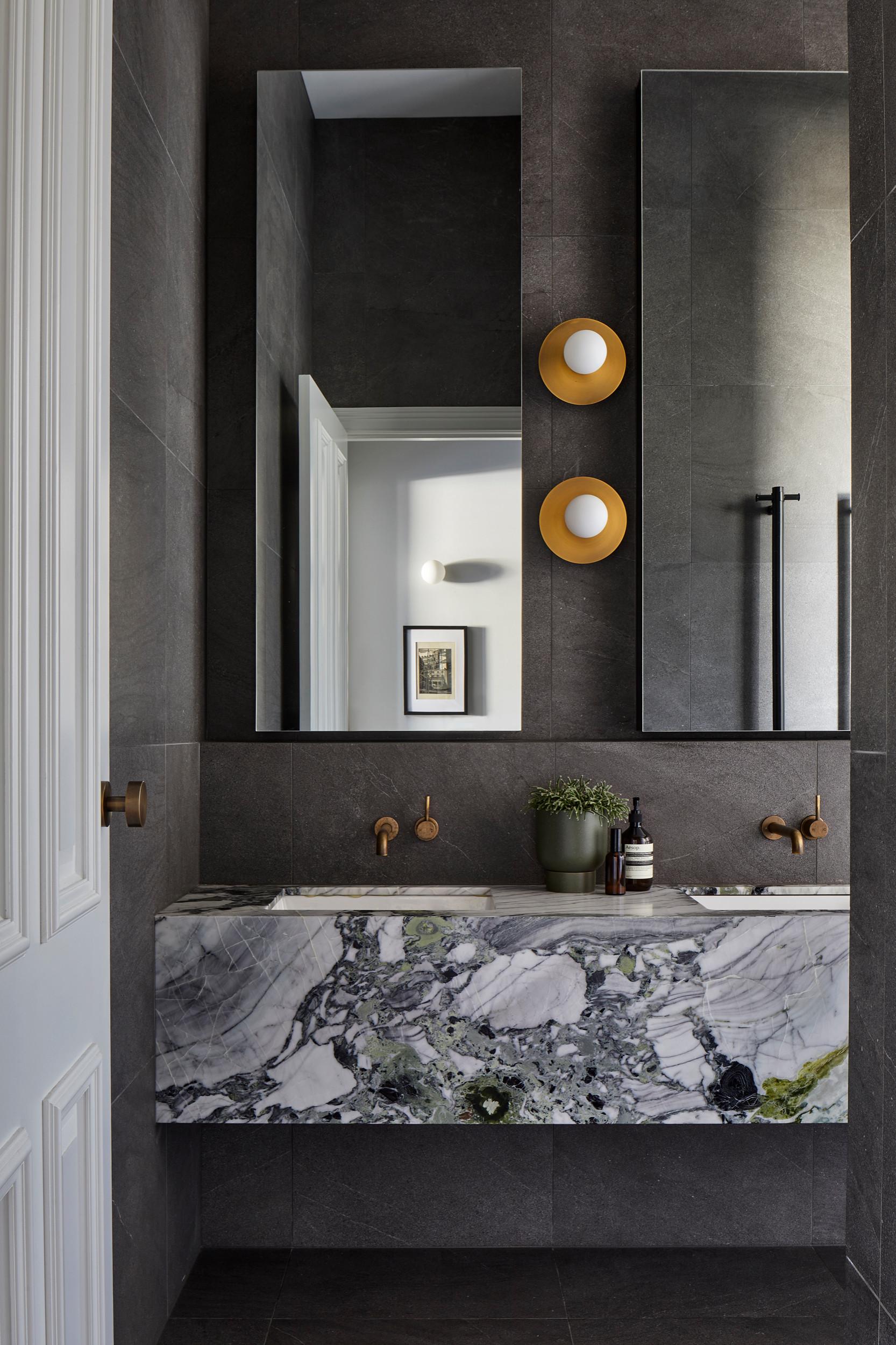 Choose an antique vanity paired ⁢with modern lighting for an eclectic bathroom contrast