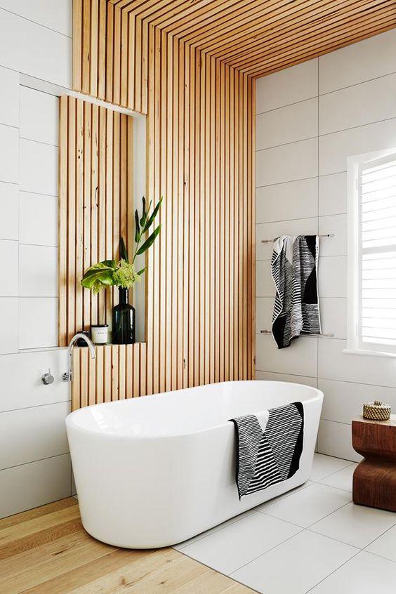 Use unexpected materials like wood and metal for an eclectic bathroom design