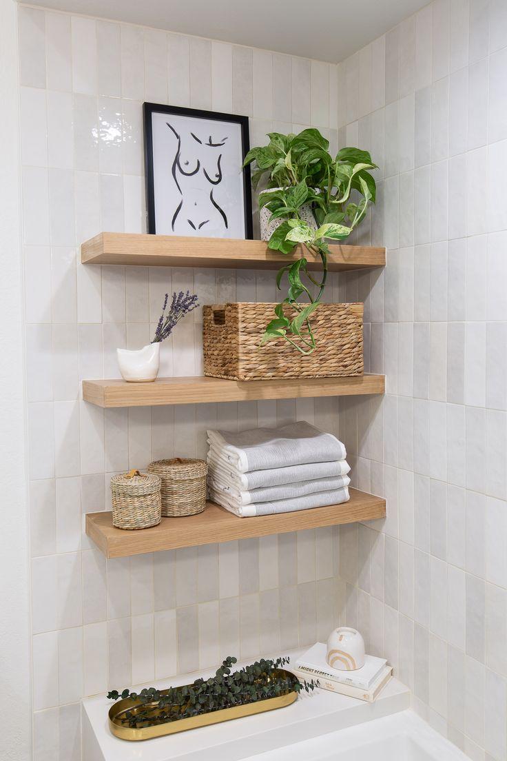 Embrace open spaces with floating shelves in your eclectic bathroom