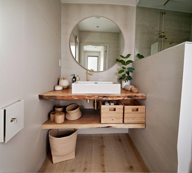 Natural wood shelving ⁢adds warmth and charm to your boho ⁤bathroom