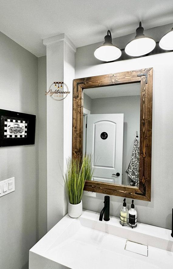 Use rustic wooden mirrors to enhance the charm of your wooden bathroom