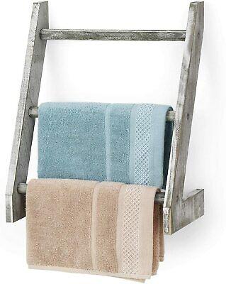 Incorporate a wooden ladder for stylish towel storage solutions