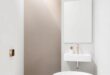 Elevate Your Space: Stylish Bathroom Wall Designs Featuring Metallic Accents