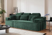 Finding Cozy Moments Together On A Plush Green Corduroy Sofa