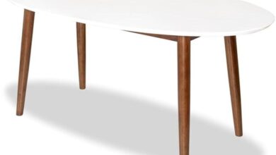 Sleek Walnut White Oval Table Perfect For Cozy Dining Spaces