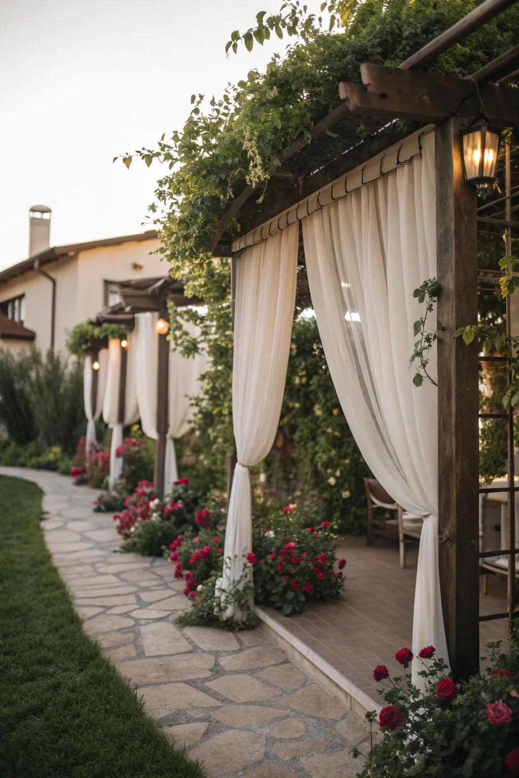 A pergola with curtains creates a cozy and private outdoor space.