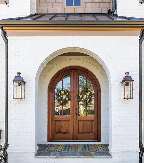 Elegant arched wooden double front doors